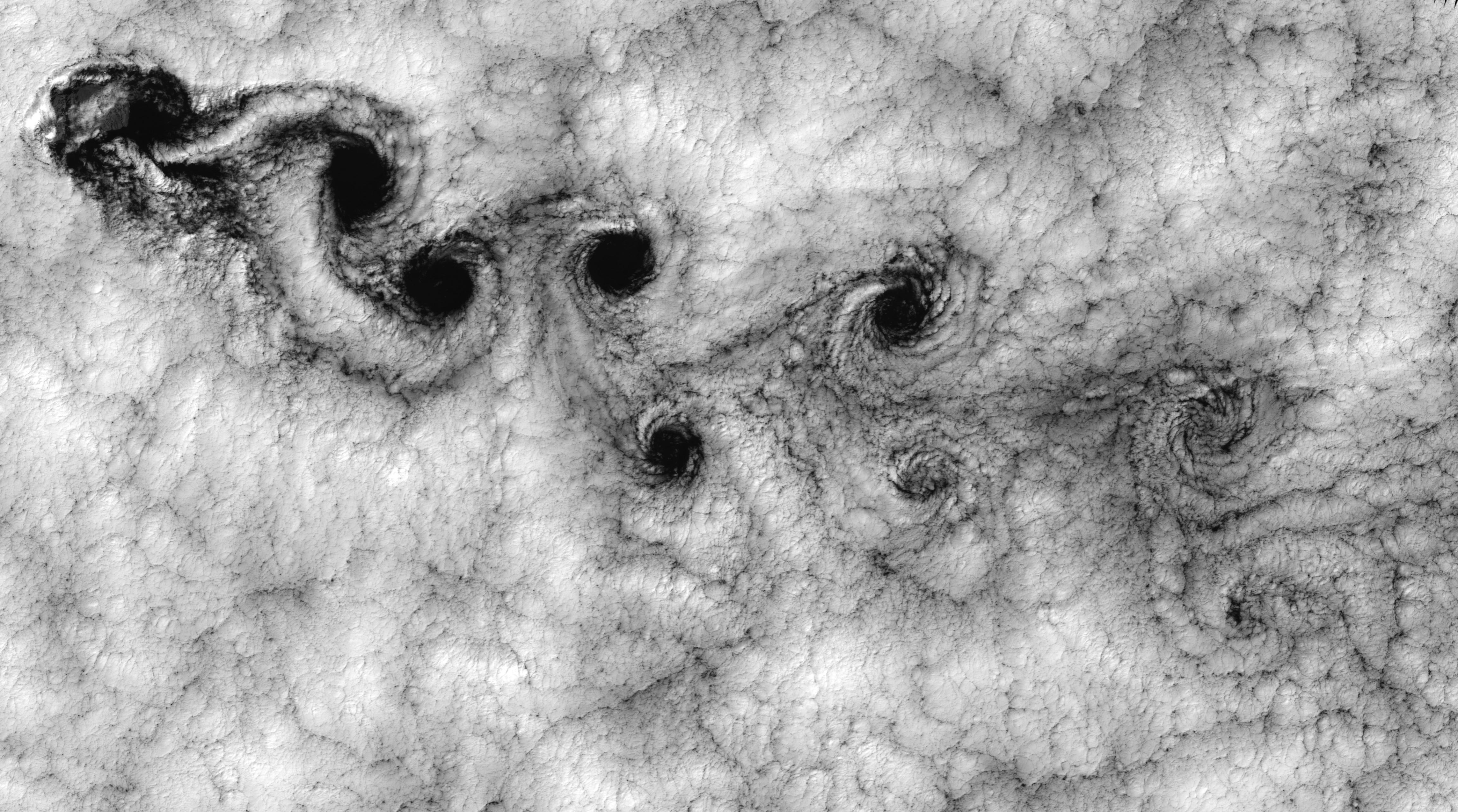 Von Karman vortex street in a marine cloud deck, seen from orbit
